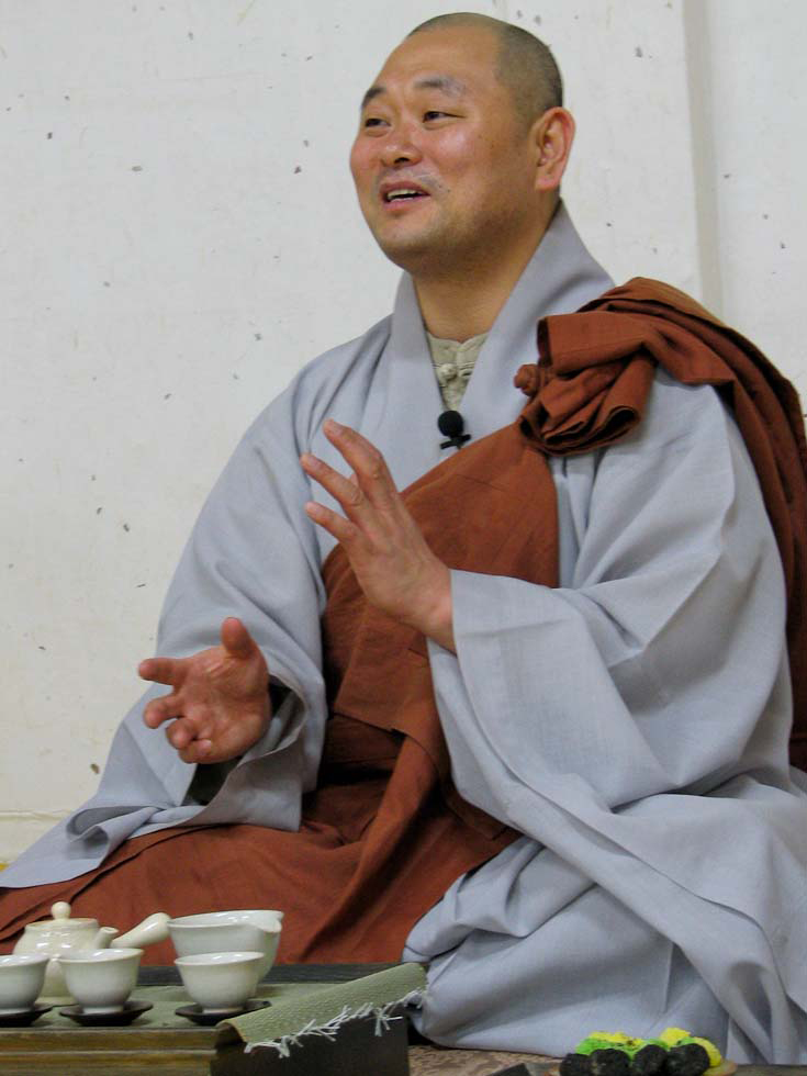 Head monk Hae Su instructing about tea ceremony. - Melanie McManus