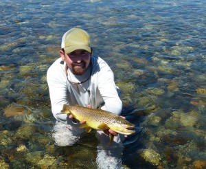 Guide on Chimehuin River with David's 23 inch brown trout